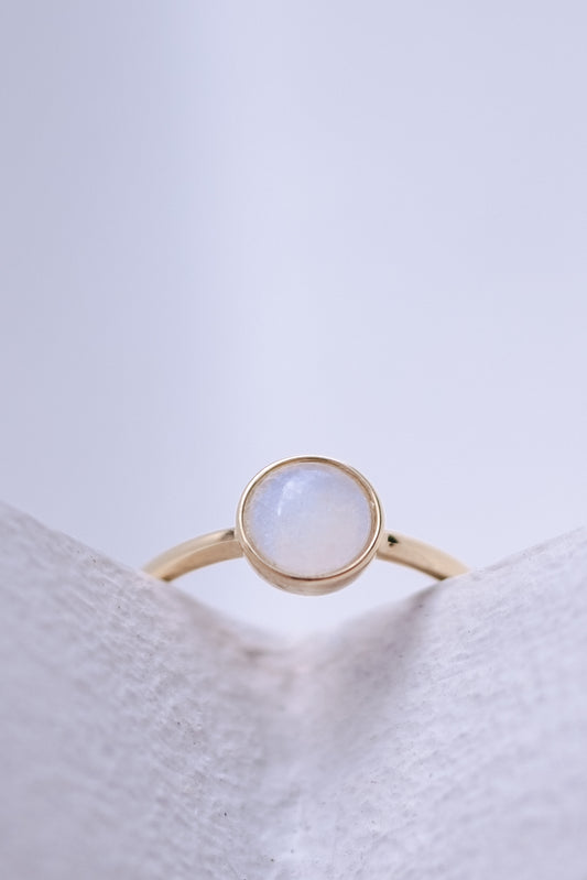 Solid gold breastmilk ring with a single keepsake stone, the Origin