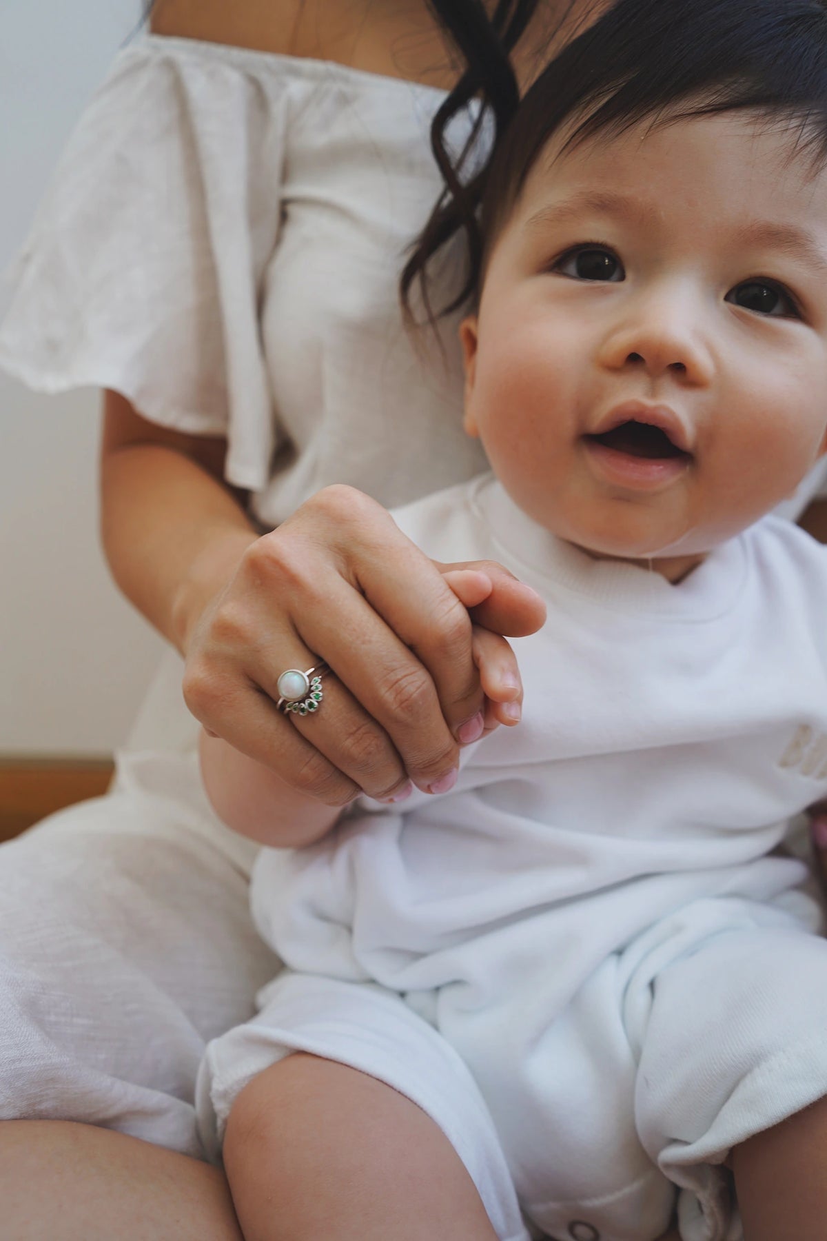 Breastmilk Cradle Rings in solid gold, worn together as a meaningful ring set