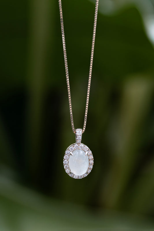 Celestine Halo Necklace, a breastmilk stone in a diamond halo on a fine gold chain