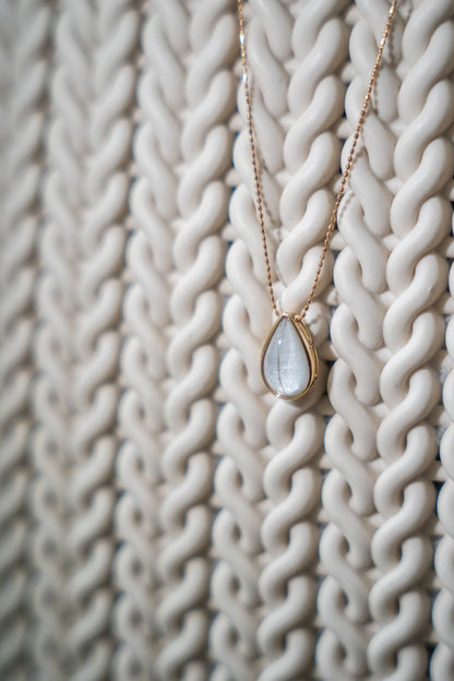 Teardrop breastmilk stone pendant on a fine gold chain, the Dewdrop Necklace