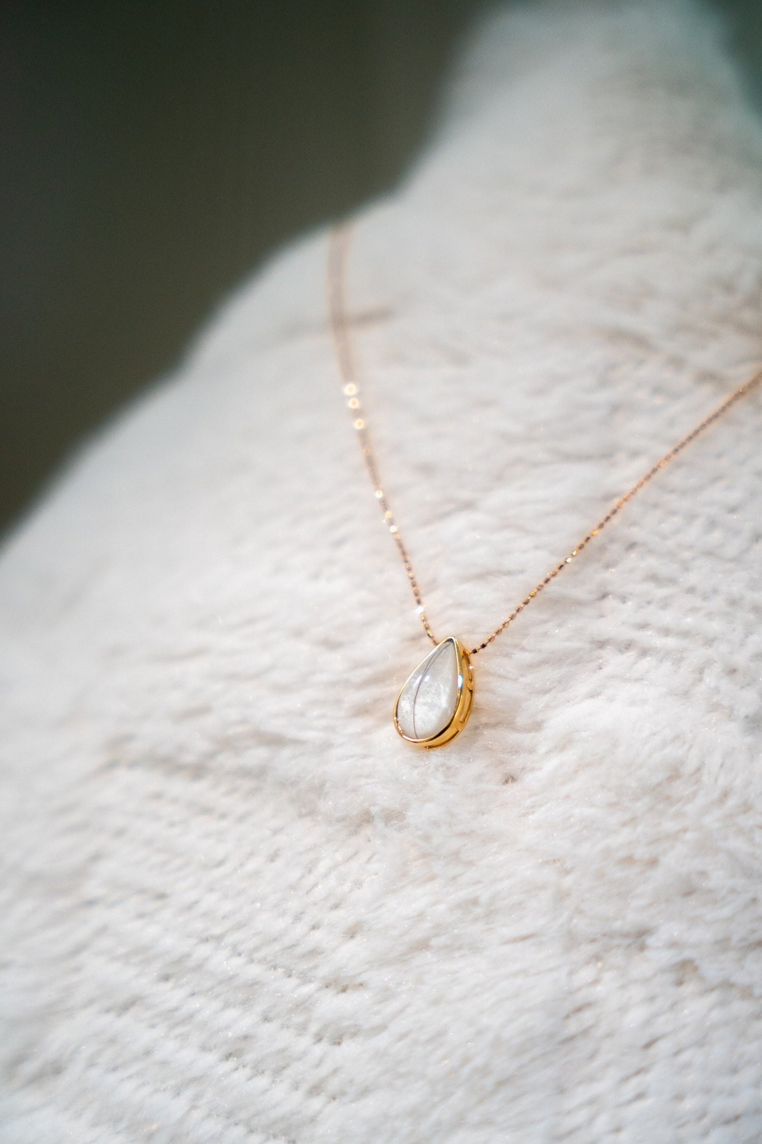 Dewdrop Necklace, a teardrop breastmilk stone on a fine gold chain
