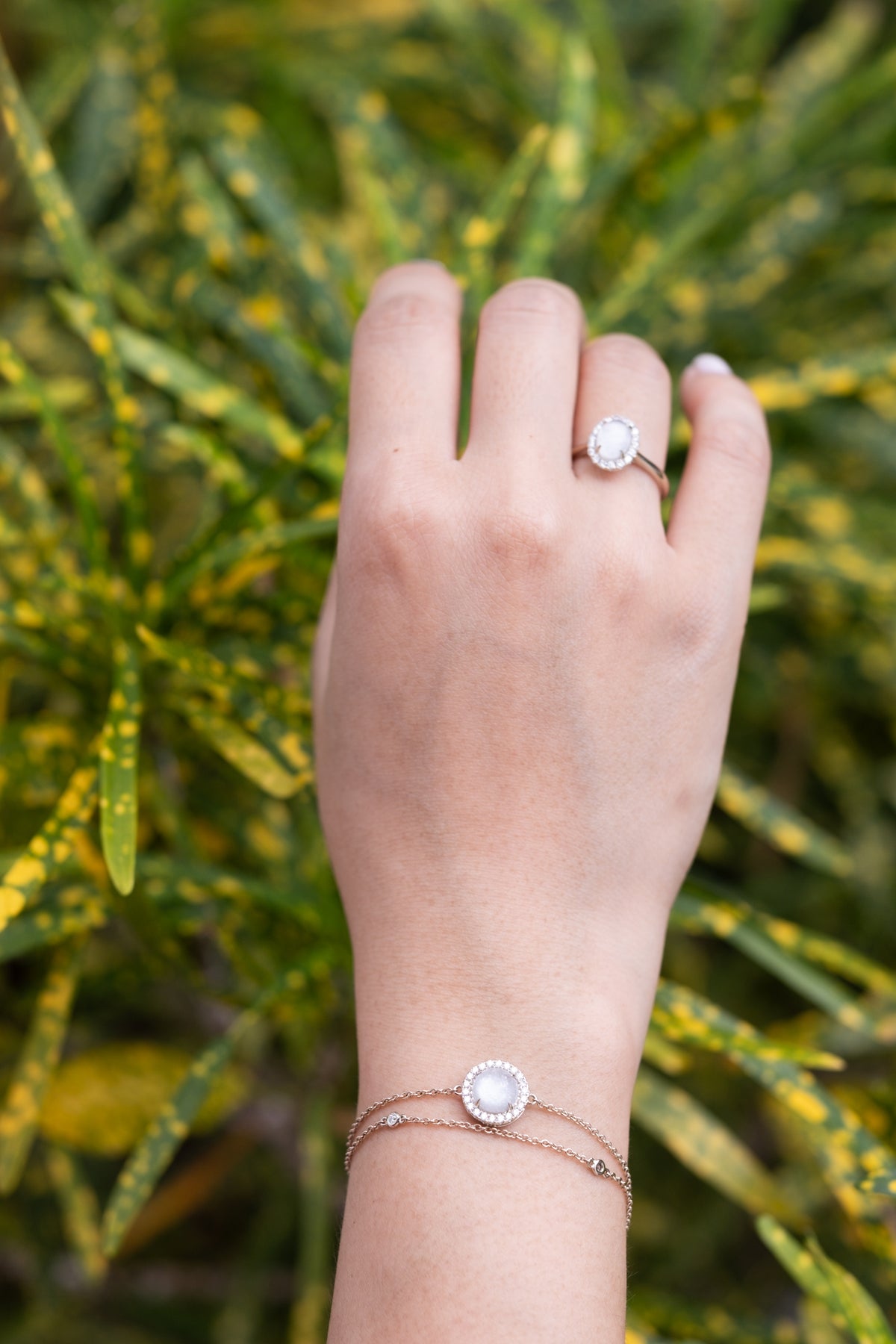 Double-chain gold bracelet with a breastmilk keepsake stone and diamond halo