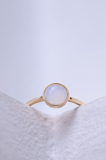 Solid gold breastmilk ring with a single keepsake stone, the Origin