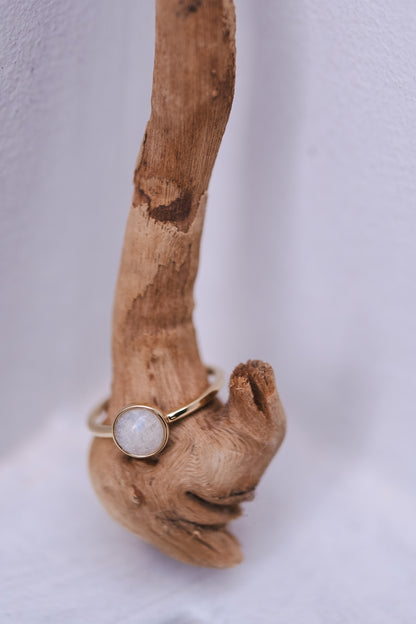 A breastmilk stone in solid gold on the minimalist Origin Ring