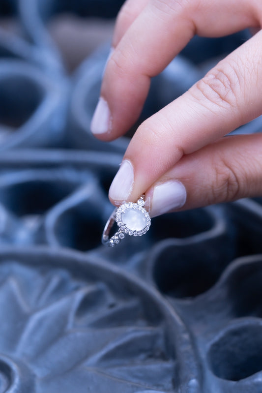 Solid gold breastmilk ring with a diamond halo and diamond-set band, the Eternity