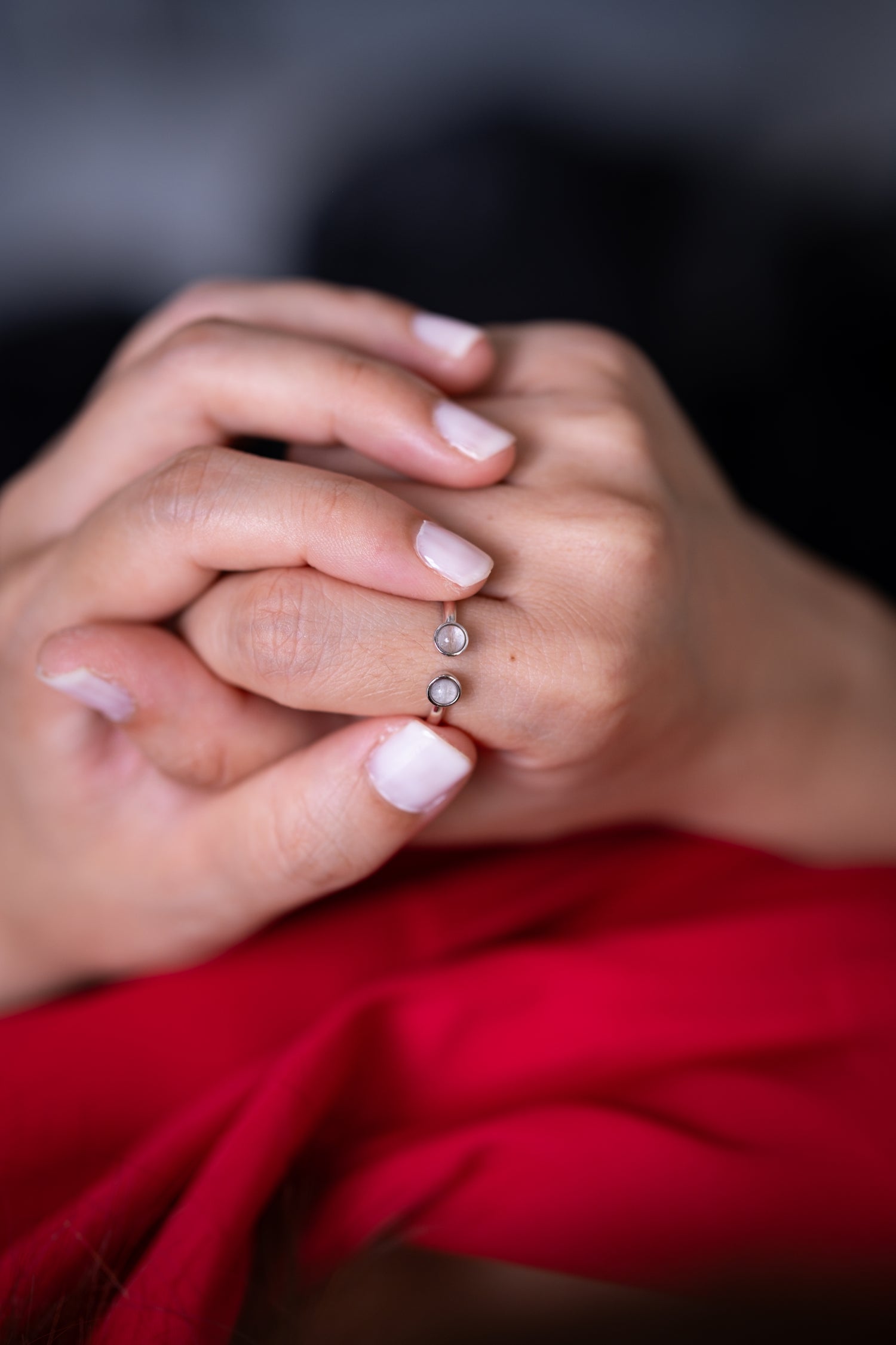 The Embrace breastmilk ring in solid gold, symbolising mother and child