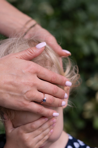 Blue Hour breastmilk keepsake ring in solid gold with a blue sapphire